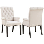 Fauteuil de salle à manger capitonné beige avec dossier roulé et clous décoratifs
